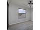 Well lit bedroom featuring a large window and hardwood floors at 1592 Bamboo Bay Dr, Henderson, NV 89012