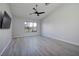 Bright bedroom with large window and ceiling fan at 1592 Bamboo Bay Dr, Henderson, NV 89012