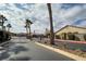 Gated community entrance with palm trees and landscaping at 1592 Bamboo Bay Dr, Henderson, NV 89012