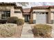 House entrance with double doors and gray garage door at 1592 Bamboo Bay Dr, Henderson, NV 89012