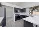 Contemporary kitchen with dark cabinetry and quartz countertops at 1592 Bamboo Bay Dr, Henderson, NV 89012