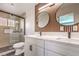 Contemporary bathroom with double vanity and frameless shower at 1700 Breezewood Dr, Las Vegas, NV 89108