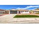 Remodeled single-story home with artificial turf and new landscaping at 1700 Breezewood Dr, Las Vegas, NV 89108