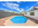 Relaxing kidney-shaped pool with concrete decking at 1700 Breezewood Dr, Las Vegas, NV 89108