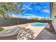 Inviting kidney-shaped pool in a backyard oasis at 1700 Breezewood Dr, Las Vegas, NV 89108