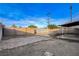 Spacious backyard featuring a block wall, covered patio, and space for landscaping and outdoor entertaining at 1906 Palora Ave, Las Vegas, NV 89169