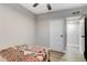 Cozy bedroom with a ceiling fan and neutral walls at 1906 Palora Ave, Las Vegas, NV 89169