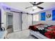 Bedroom with barn doors and a ceiling fan at 1906 Palora Ave, Las Vegas, NV 89169