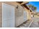 Side view of home showcasing a white gate and landscaping at 1906 Palora Ave, Las Vegas, NV 89169