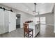 Open concept kitchen with island, white cabinets, and a view into the living room at 1906 Palora Ave, Las Vegas, NV 89169