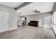 Bright living room with hardwood floors and a brown couch at 1906 Palora Ave, Las Vegas, NV 89169