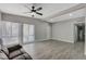 Living area with hardwood floors and a ceiling fan at 1906 Palora Ave, Las Vegas, NV 89169