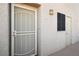 Condo front door with security screen at 2044 Mesquite Ln # 302, Laughlin, NV 89029