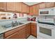 Kitchen with wood cabinets and pass-through at 2044 Mesquite Ln # 302, Laughlin, NV 89029