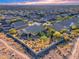 Aerial view of the house and surrounding neighborhood with distant mountain views at 2064 Poetry Ave, Henderson, NV 89052