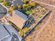 Aerial view of house with a putting green and palm trees in the backyard at 2064 Poetry Ave, Henderson, NV 89052