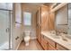 Bathroom featuring a glass enclosed shower, vanity with mirror, tile floor and natural light at 2064 Poetry Ave, Henderson, NV 89052