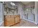 Modern bathroom with shower, vanity, and tile flooring at 2064 Poetry Ave, Henderson, NV 89052