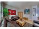 Relaxing living room with hardwood floors and leather sofas at 2064 Poetry Ave, Henderson, NV 89052