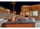 Outdoor kitchen with stainless steel appliances and granite countertops at 2064 Poetry Ave, Henderson, NV 89052