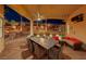 Covered patio with outdoor dining and seating at 2064 Poetry Ave, Henderson, NV 89052