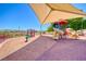 A colorful playground featuring slides, a covered play area, and safety surfacing under a bright blue sky at 2064 Poetry Ave, Henderson, NV 89052