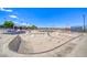 An expansive skate park with smooth concrete ramps and curves providing a challenging space for skaters at 2064 Poetry Ave, Henderson, NV 89052