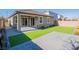 Artificial turf lawn with covered patio and paver walkway at 2242 Valdina St, Henderson, NV 89044