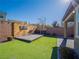 Artificial turf lawn with wooden wall and entertainment area at 2242 Valdina St, Henderson, NV 89044