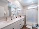 Double vanity bathroom with a walk-in shower at 2242 Valdina St, Henderson, NV 89044