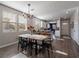 Bright dining room features a long wooden table and modern chandelier at 2242 Valdina St, Henderson, NV 89044