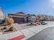 House exterior showcasing a brown garage door and well-manicured landscaping at 2242 Valdina St, Henderson, NV 89044