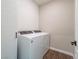 Laundry room with washer and dryer and white tile at 2242 Valdina St, Henderson, NV 89044