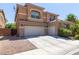 Two-car garage and welcoming front entrance at 2316 Mountain Rail Dr, North Las Vegas, NV 89084