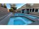 Resort-style backyard with a large pool and spa at 2316 Mountain Rail Dr, North Las Vegas, NV 89084