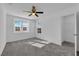 Bright bedroom with a ceiling fan, natural light, and a walk-in closet at 2430 Bellinzona Pl, Henderson, NV 89044