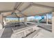 Shaded picnic area featuring concrete tables and access to the playground at 2430 Bellinzona Pl, Henderson, NV 89044