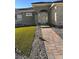 Modern house with arched entryway and manicured lawn at 2571 Bonano Ct, Las Vegas, NV 89108