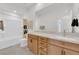 Bathroom with a shower, toilet, vanity with light wood cabinets, and a large mirror at 2598 Iron Crest Ln, Las Vegas, NV 89138