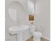 Bathroom with pedestal sink and a circular mirror at 2598 Iron Crest Ln, Las Vegas, NV 89138