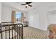 Well-lit Bedroom featuring a crib and ample closet space at 2598 Iron Crest Ln, Las Vegas, NV 89138