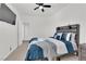 Bedroom with a wooden bed frame and ceiling fan at 2598 Iron Crest Ln, Las Vegas, NV 89138