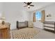 Neutral Bedroom with crib, changing table, and ceiling fan at 2598 Iron Crest Ln, Las Vegas, NV 89138