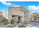 Two-story house with stone accents and landscaped front yard at 2598 Iron Crest Ln, Las Vegas, NV 89138