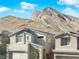 Modern house exterior with mountain backdrop at 2598 Iron Crest Ln, Las Vegas, NV 89138