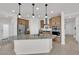 Modern kitchen with island, stainless steel appliances, and light wood cabinets at 2598 Iron Crest Ln, Las Vegas, NV 89138