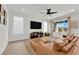 Living room with large sectional sofa and big screen TV at 2598 Iron Crest Ln, Las Vegas, NV 89138