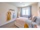 Light and airy bedroom with a comfortable bed and hanging space at 2637 Snapdragon Falls Ave # 105, North Las Vegas, NV 89081