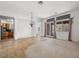 Spacious dining area with tile flooring, chandelier, and views into kitchen at 3020 Via Venezia, Henderson, NV 89052