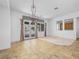 Bright dining room featuring tile floors and access to the backyard patio at 3020 Via Venezia, Henderson, NV 89052